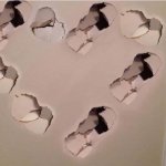 Wall punches shaped into a heart meme