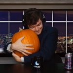 Guy hugging pumpkin