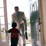 Child greeting parent at the door