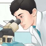 lab scientist with microscope