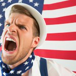 patriotic man screaming in front of american flag