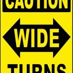 caution wide turns sign