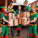 group of elves delivering presents from Amazon