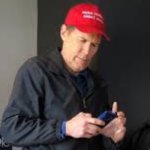 TEXTING IN A MAGA HAT