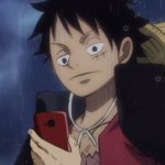 One Piece Luffy looking at phone