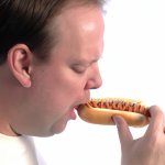 man eating a hotdog