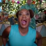 bald black woman in white house christmas video