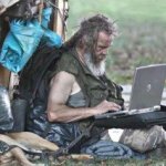 Poor man with laptop