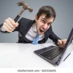 Man hitting computer