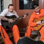 Prisoners playing guitars