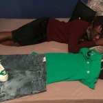 Man sleeps with clothes beside him