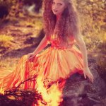 FALL LEAVES AND PRETTY REDHEAD WITH CURLS, FIRE