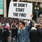 He didn't start the fire | He didn't start the fire! | image tagged in man holding sign | made w/ Imgflip meme maker