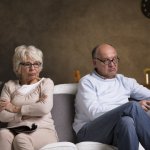 Old Couple On Couch Angry