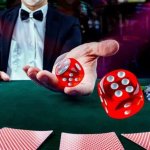 Dealer rolls dice in casino