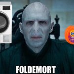 Voldemort doing laundry | FOLDEMORT | image tagged in lord voldemort,voldemort,dirty laundry,laundry,clothes,funny memes | made w/ Imgflip meme maker