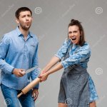 Woman Hitting Man with Rolling Pin