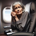Scared little old lady sitting in airplane seat.