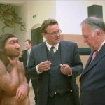 2 men talking and 1 monkey