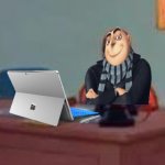 Gru at a desk with a Microsoft Surface