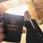 Mormon guy handing you book