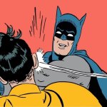 Batman and Robin face slap