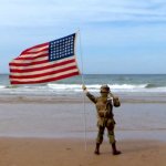 kid saluting to the ghosts of soldiers at normandy