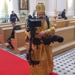 Holy man with camera