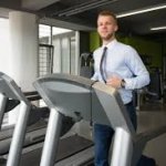 business man running on treadmill