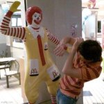 Ronald McDonald slapping a kid