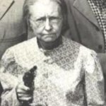 Granny Clampett pointing pistol