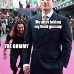 Gummy sneaking up | Me after taking my third gummy; THE GUMMY | image tagged in aquaman sneaking up on superman | made w/ Imgflip meme maker