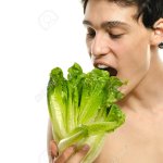 man eating vegetables