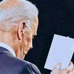 Biden reading a note on a piece of paper template