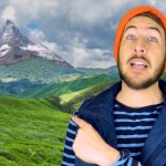 Ryan George pointing at a mountain