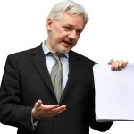 Julian Assange Holding Paper
