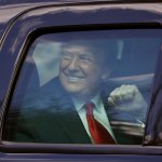 Trump in car like a child