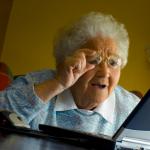 Old lady at computer finds the Internet