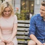 shy woman interested man on park bench