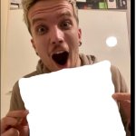 marko holding up a sheet of paper template