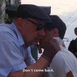 man telling young man