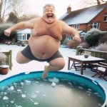 a big fat american average joe jumping on a icy pool in the wint