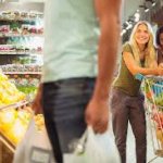 women checking out a guy shopping