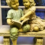 Boy & girl reading a book