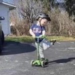 Kid on scooter leg up adorable