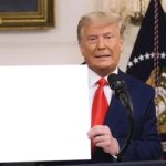 Trump holding sign