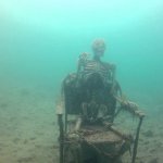 Skeleton on a chair underwater