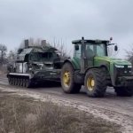 Ukrainian farmer towing Russian tank