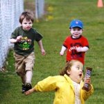 kids chasing chocolate bar girl
