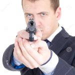 Person pointing Gun at Camera
